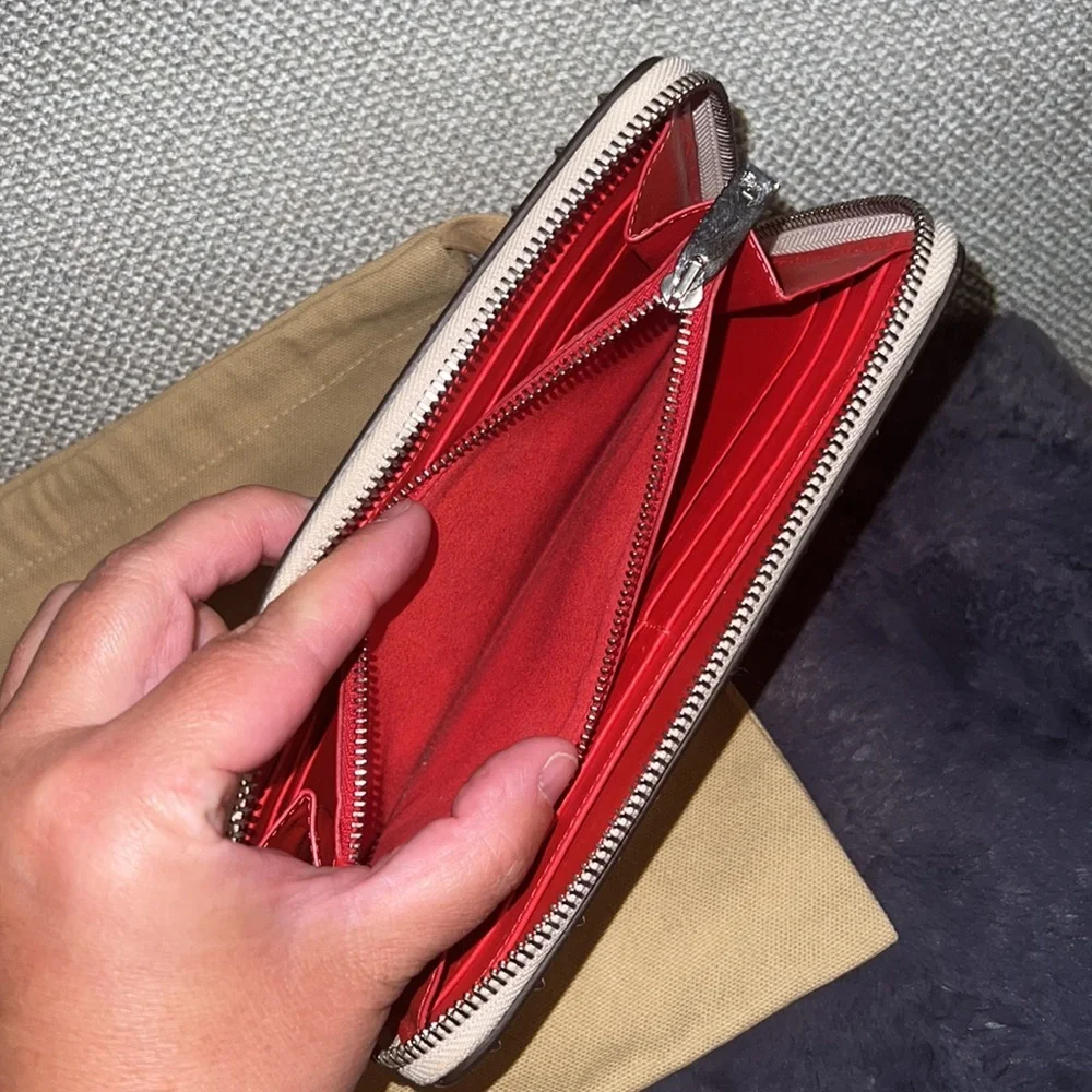 EUC Authentic Christian Louboutin Panettone pale pink zippy wallet and dust bag
